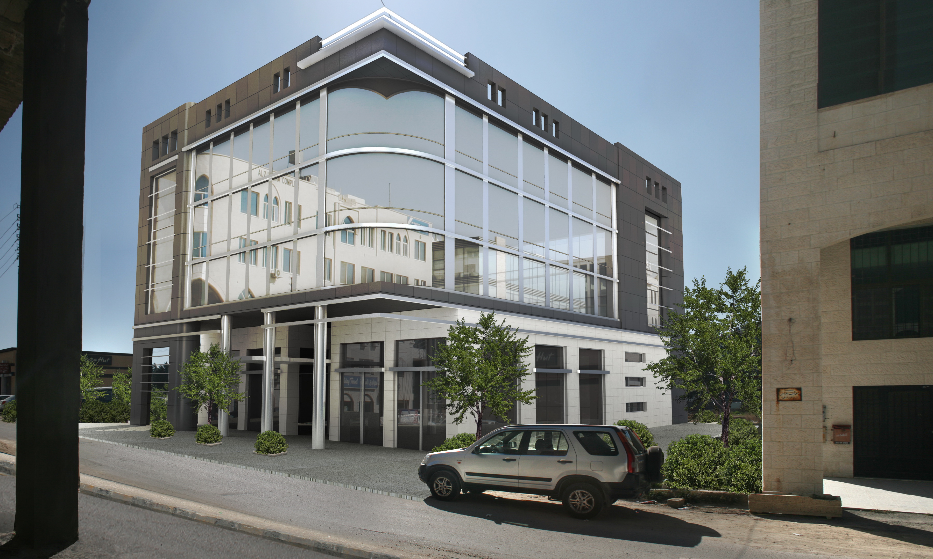 Closer view of the Khirfan commercial building glass corner facade