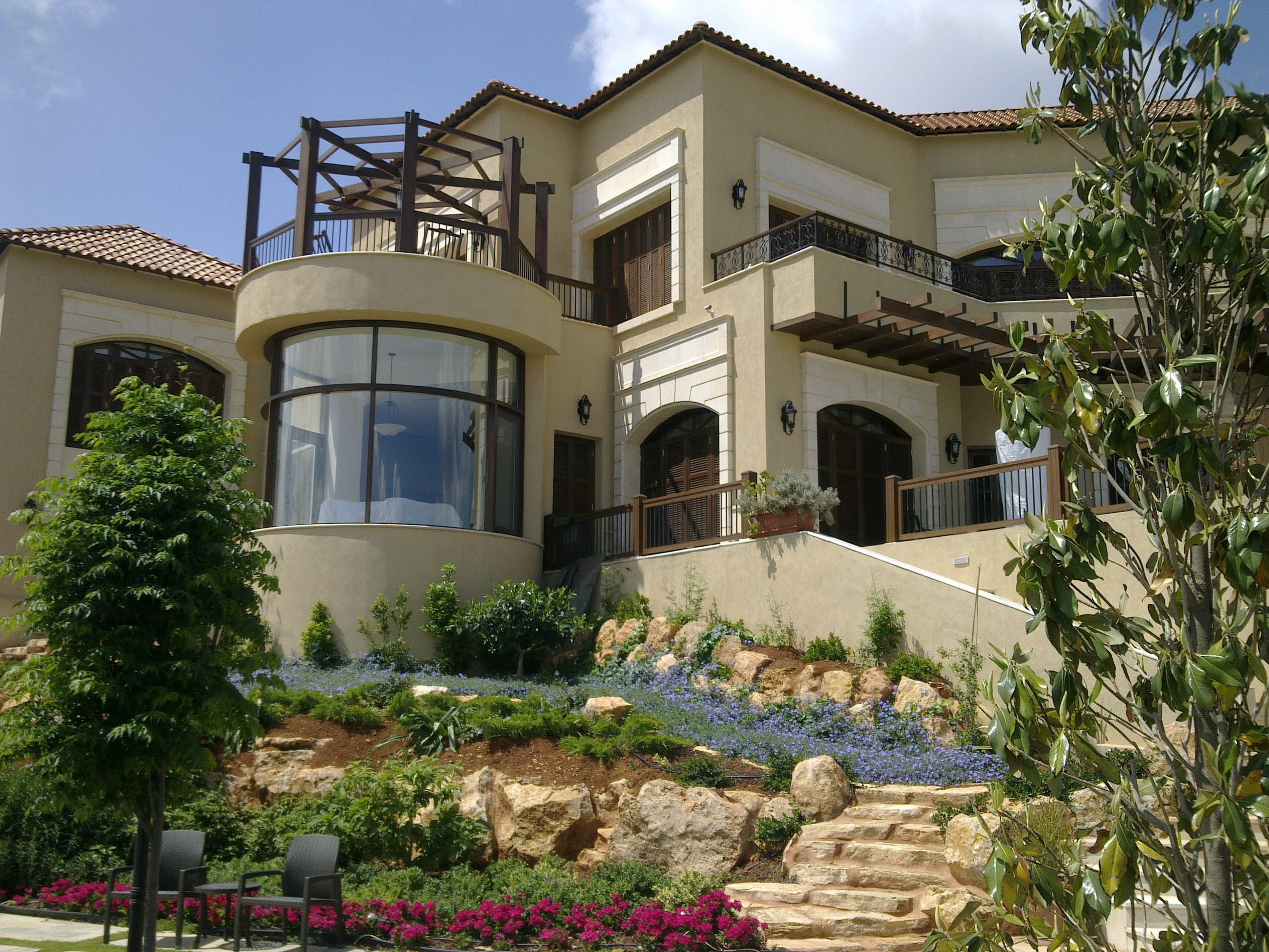 Toukan residence pool terrace with outdoor pavilion and evening seating